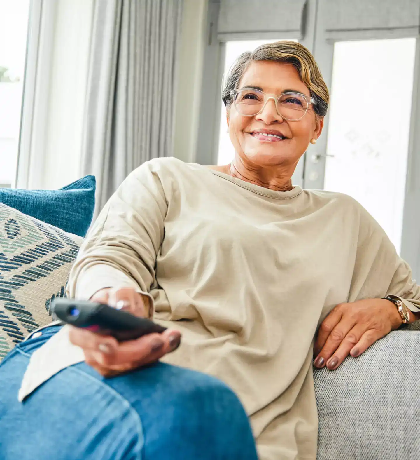 matureLatinaWomanWatchingTv
